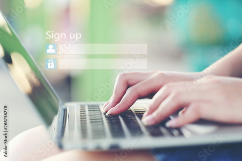 Принти на полотні Young woman using laptop computer and sign up or log in username password in coffee shop,GDPR