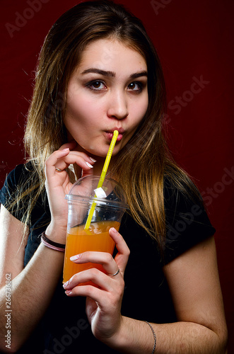 portrait of a girl with a cocktail in the Studio