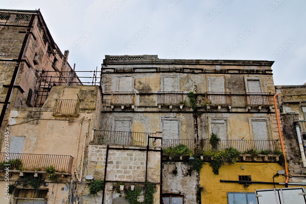 Abandoned, uninhabited and dilapidated buildings in the old town of Taranto, Puglia, Italy.