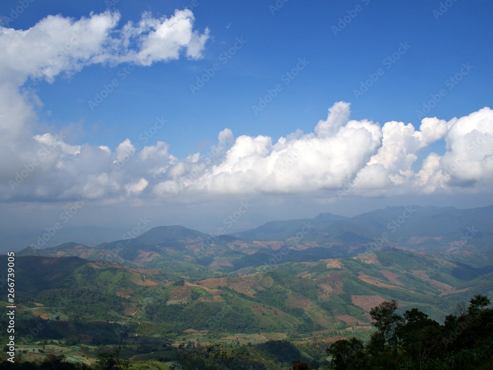The landscape of green mountain and the pattern of cloud and bluesky