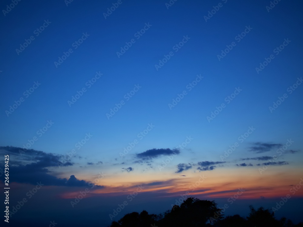 The twilight sky with dark cloud and the blue sky and silhouette, Nan, Thailand