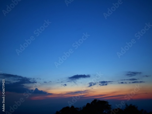 The twilight sky with dark cloud and the blue sky and silhouette, Nan, Thailand © Paphinvich