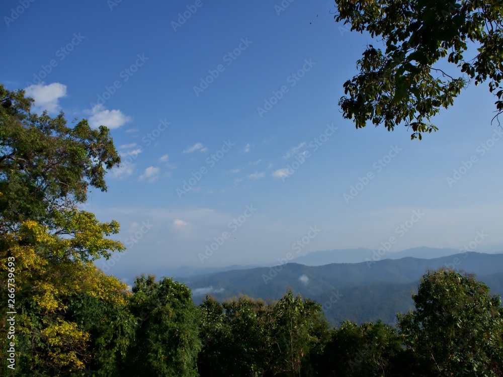 The mountain landscape at the morning with tree at the front in Nan, Thailand The mountain landscape at the morning with tree at the front in Nan, Thailand