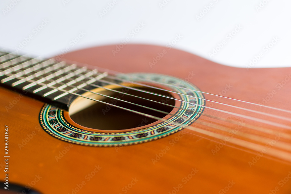 Classic acoustic guitar on white background view. Classic acoustic guitar on white background view.