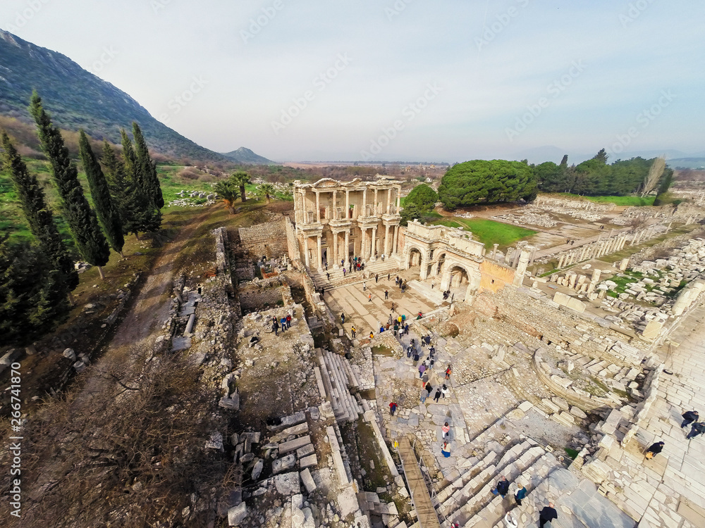 Aerial view of Celcius Library from Ephesus Ancient City with some tourists in view.