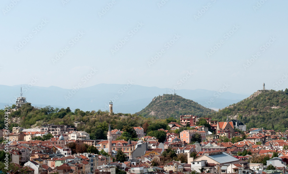 Wiew from the high to the city center of Plovdiv and the hills Djendemtepe and Bunardjic. The mountains in the background. Plovdiv, Bulgaria