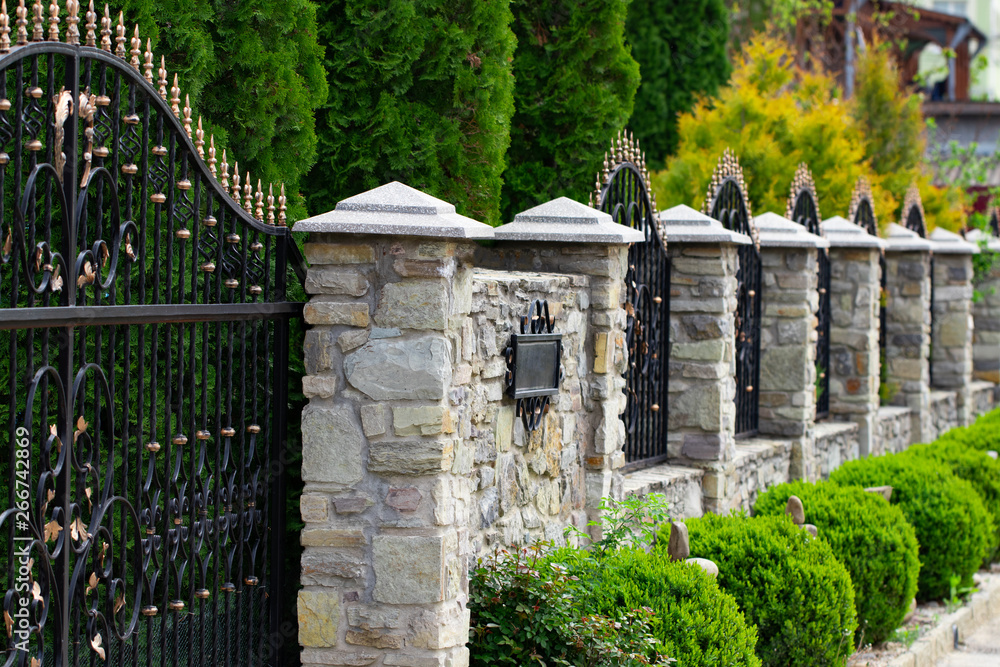 Naklejka premium Wrought-iron gates, ornamental forging, forged elements close-up.