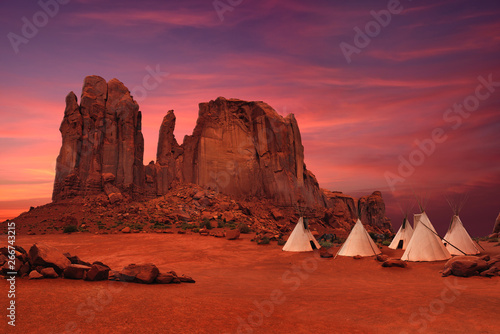 Wigwams/tepees of native Americans in Monument Valley at sunset, Arizona-Utah border, USA