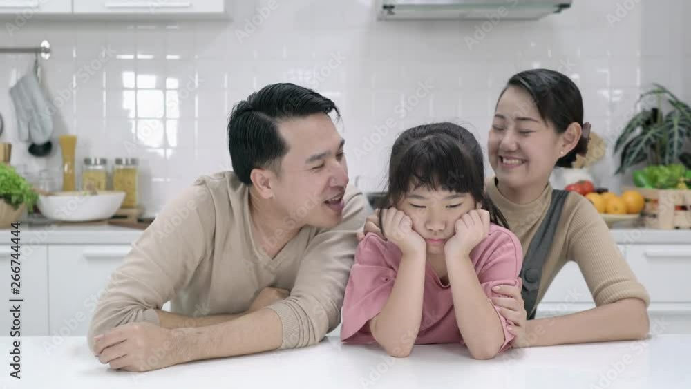 Happy asian family enjoying together in kitchen at home. Concept of happy family, quality life, mental health and positive psychology.