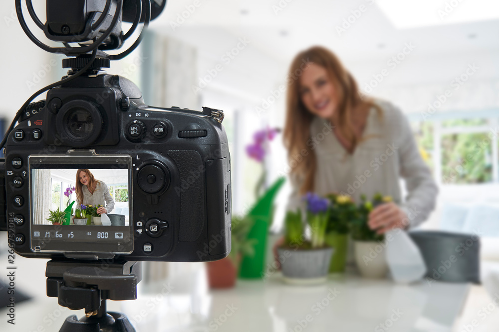 Female Vlogger Making Social Media Video About Houseplant Care For The Internet