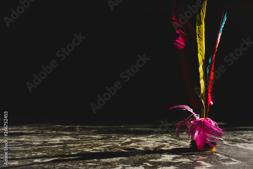 Close up of a jianzi, a heavily weighted shuttlecock originated from China, in matte background. photo