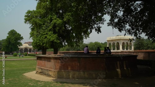 In the gardens and inner courtyard at the Red Fort  (Lal Qila) with shrubs and benches.   Handheld. photo