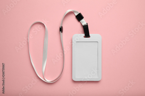 Staff badge mockup, name tag card on pink background. Identification, accessibility, advertising, attachment, backstage.