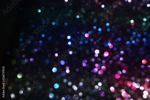 glitter vintage lights background. red, black, purple and blue. de-focused