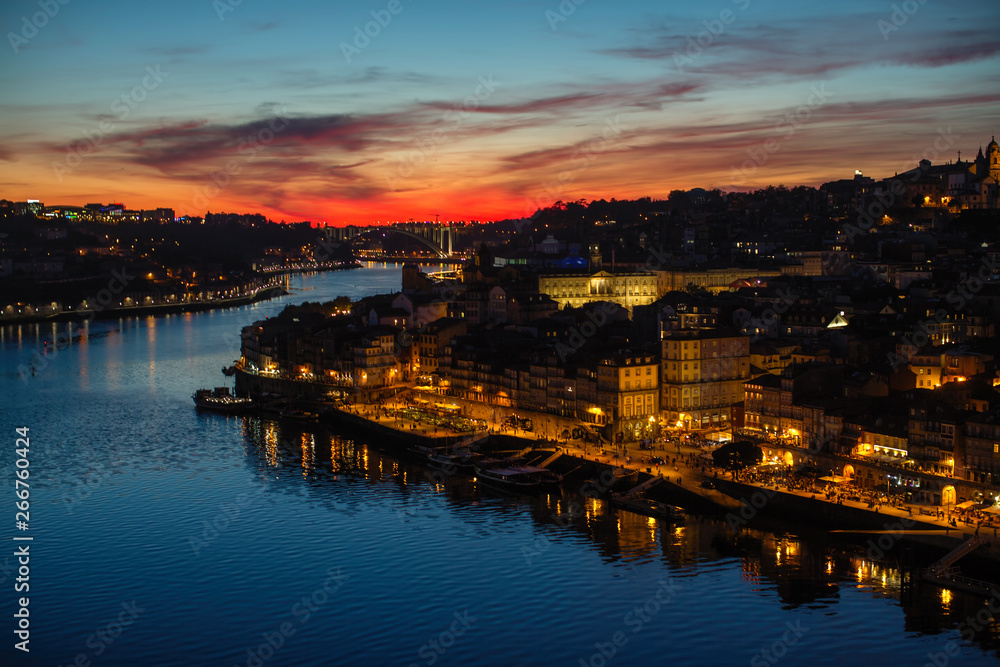 Views of the Ribeira and Douro river from Dom Luis I bridge during a beautiful twilight, Porto, Portugal.