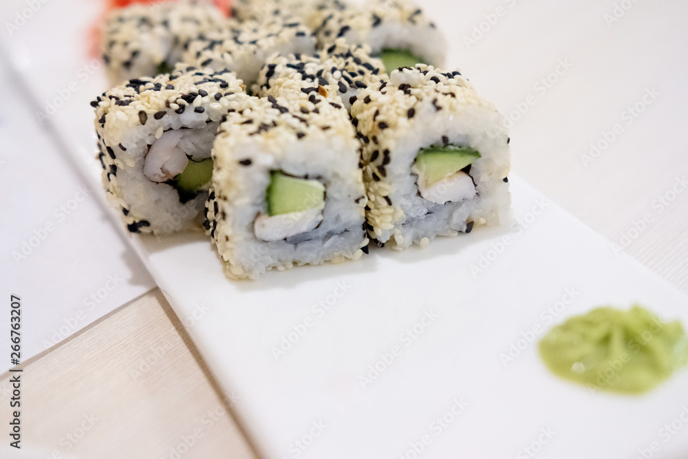 Sushi roll sushi with prawn, avocado, cream cheese, sesame. Sushi menu. Japanese food. Sushi roll sushi with prawn, avocado, cream cheese, sesame. Sushi menu. Japanese food.