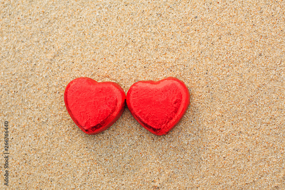 Chocolate color Lovely red heart on the beach. Background is a natural in real place, creative Valentine's Day Concept, tropical style background made in Phuket, Thailand. Chocolate color Lovely red heart on the beach. Background is a natural in real place, creative Valentine's Day Concept, tropical style background made in Phuket, Thailand.