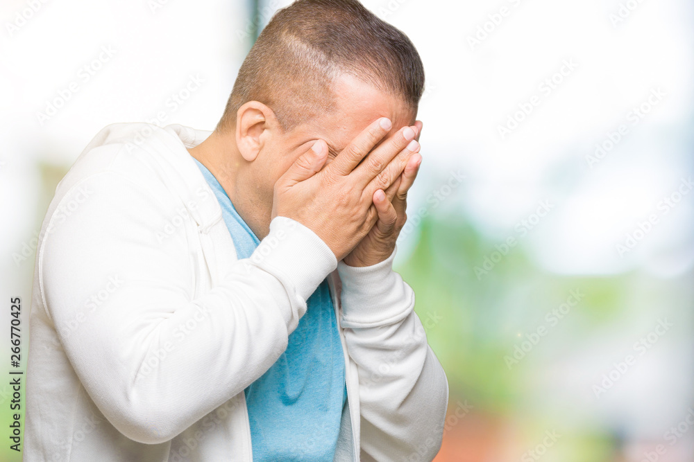 Middle age arab man wearing sweatshirt over isolated background with sad expression covering face with hands while crying. Depression concept. Middle age arab man wearing sweatshirt over isolated background with sad expression covering face with hands while crying. Depression concept.