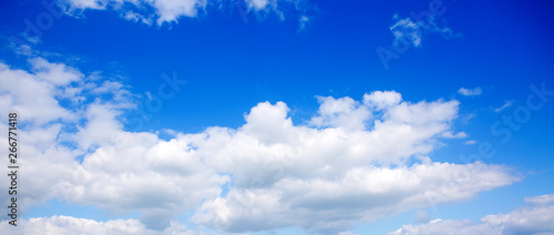 Fototapeta Naklejka Na Ścianę i Meble -  Big white fluffy clouds in the blue sky.