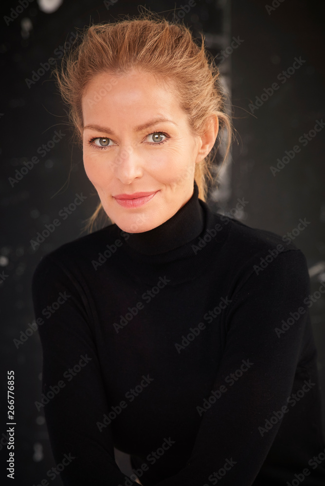 Attractive blond hair mature woman studio portrait Attractive blond hair mature woman studio portrait