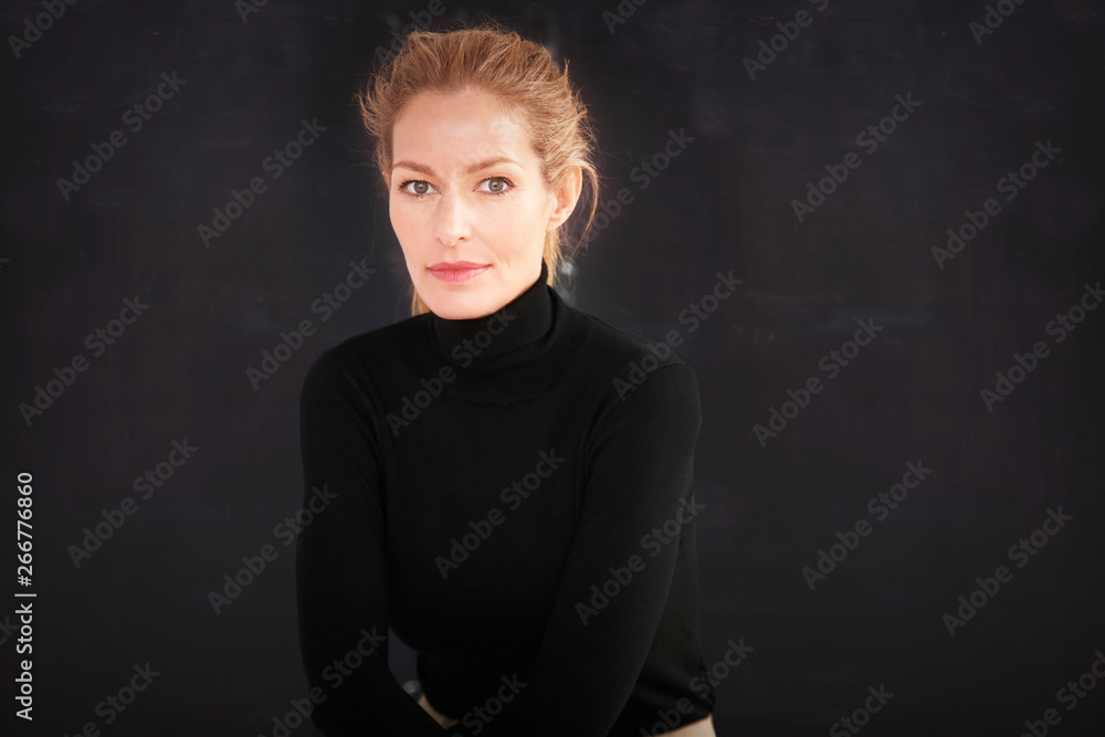 Attractive blond hair mature woman studio portrait Attractive blond hair mature woman studio portrait