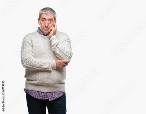 Handsome senior man wearing winter sweater over isolated background thinking looking tired and bored with depression problems with crossed arms. © Krakenimages.com