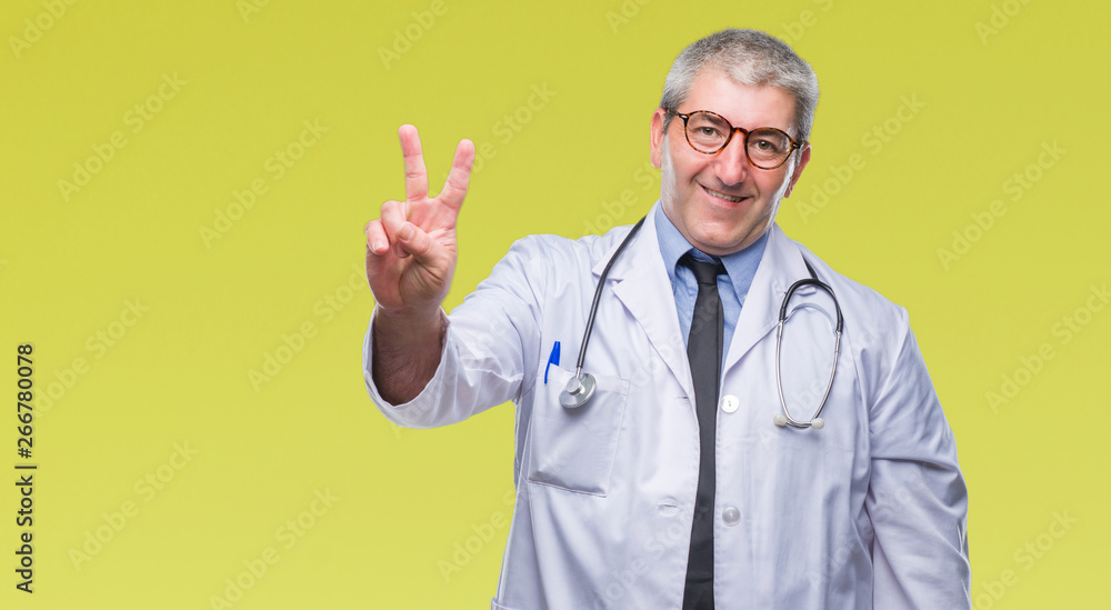 Handsome senior doctor man over isolated background smiling with happy face winking at the camera doing victory sign. Number two. Handsome senior doctor man over isolated background smiling with happy face winking at the camera doing victory sign. Number two.