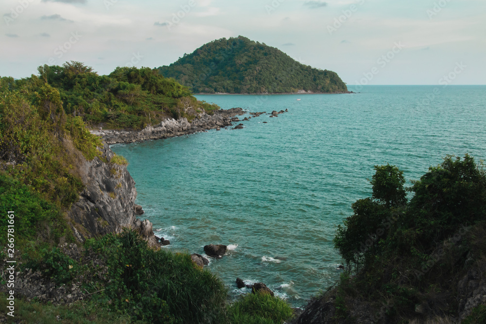 Fototapeta premium Beautiful sea view point with dramatic golden sky at Noen Nangphaya,famous andmark,Chanthaburi Province,Thailand.