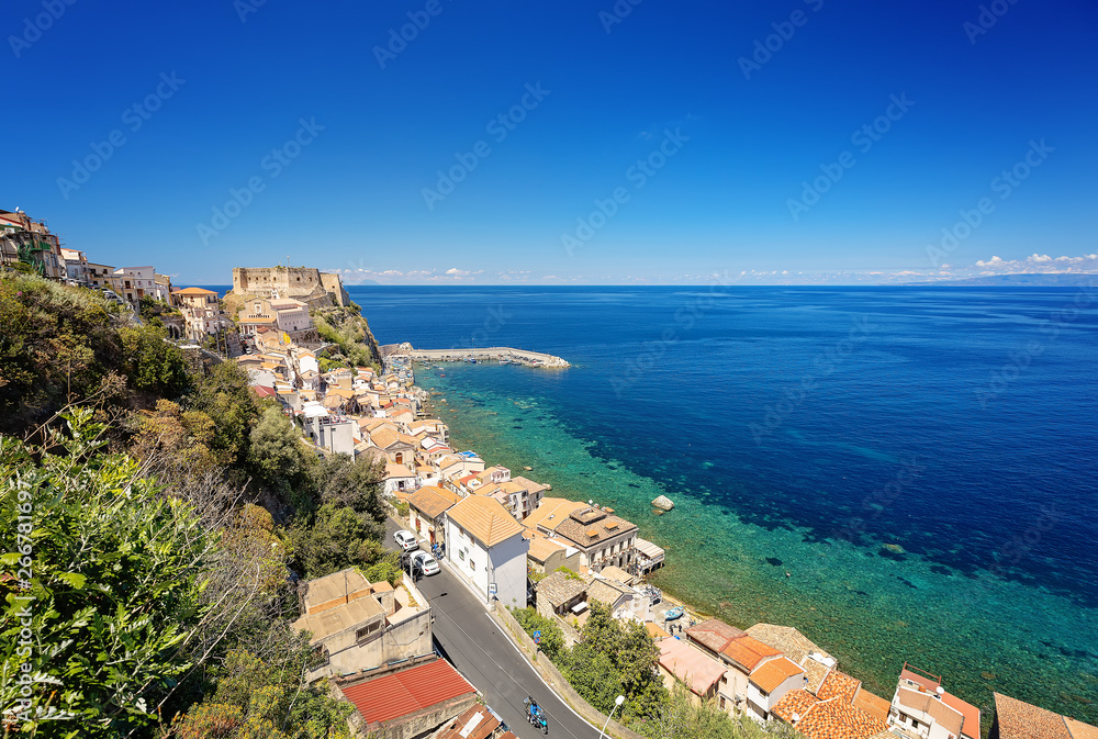 Panorama with beautiful coastline and old castle of medieval town of Scilla in Calabria, Italy. Italian summer travel holiday.