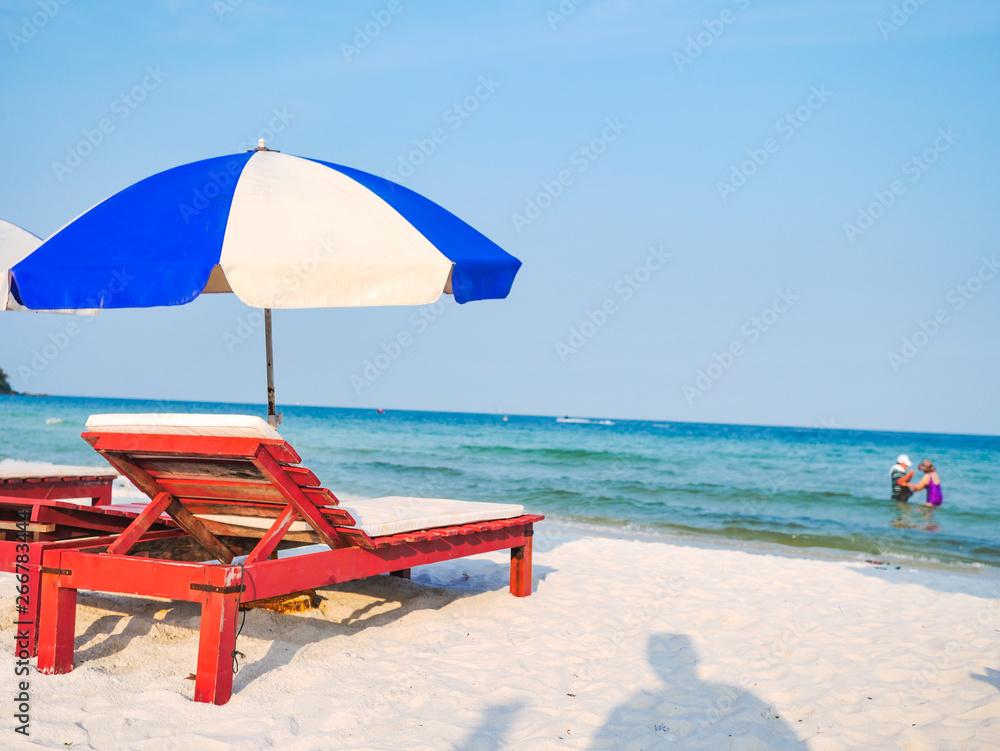 Outdoor with umbrella and chair on beautiful tropical beach and sea and blue sky background on Phu Quoc island Vietnam Outdoor with umbrella and chair on beautiful tropical beach and sea and blue sky background on Phu Quoc island Vietnam