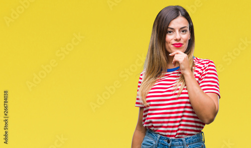 Young beautiful woman casual look over isolated background looking confident at the camera with smile with crossed arms and hand raised on chin. Thinking positive.