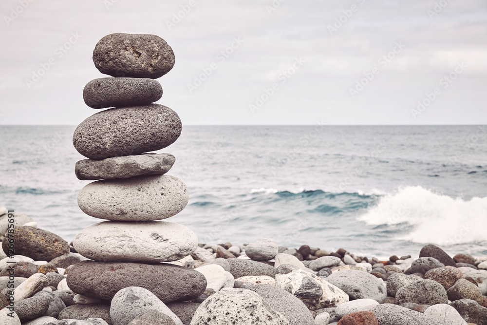 Color toned picture of a stone stack on a beach. Color toned picture of a stone stack on a beach.