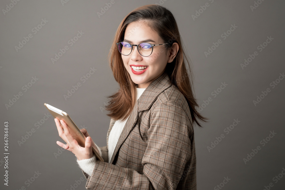 Portrait of Attractive business woman in studio grey background