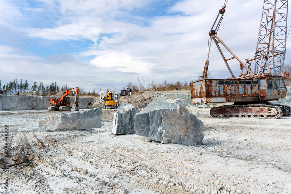 old marble quarry with heavy machinery old marble quarry with heavy machinery