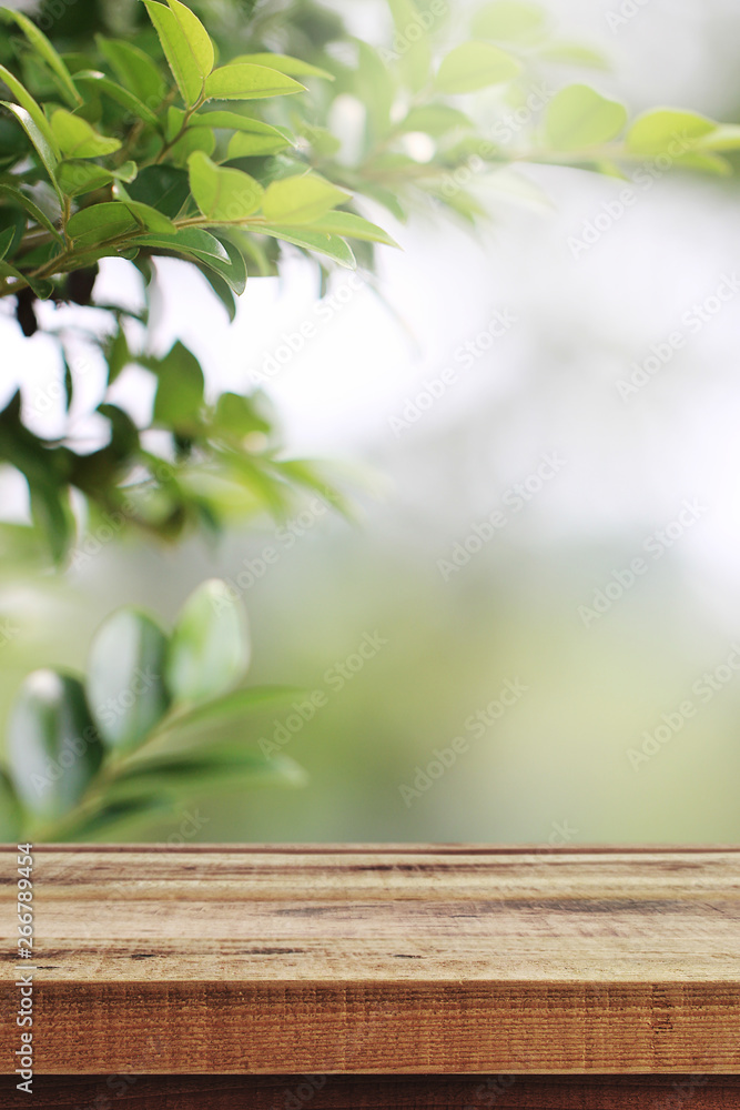 Wooden table and blurred green nature garden background. Wooden table and blurred green nature garden background.