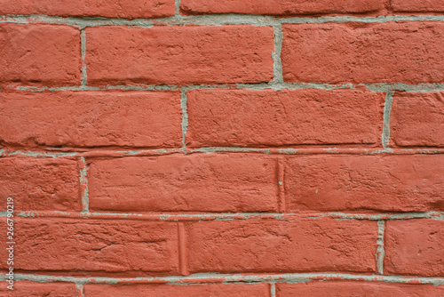 red brick wall close perspective. Close up vertical photo of redhead background