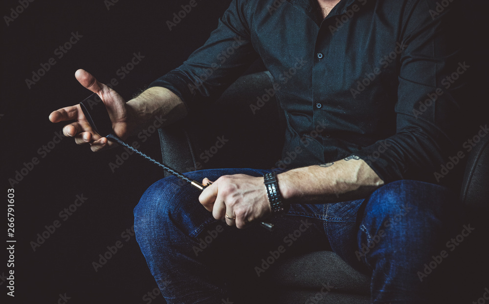 Fototapeta premium Strict man with bat. BDSM concept.