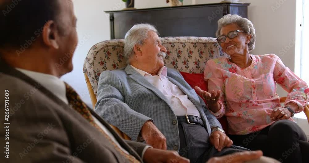 Group of Mixed race senior friends interacting with each other at nursing home Group of Mixed race senior friends interacting with each other at nursing home
