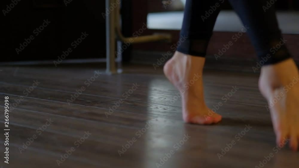 dancer bare feet step on toes on floor at ballet barre dancer bare feet step on toes on floor at ballet barre