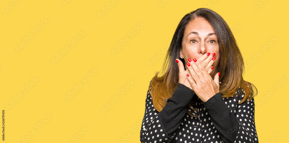 Beautiful middle age woman wearing fashion jacket shocked covering mouth with hands for mistake. Secret concept. Beautiful middle age woman wearing fashion jacket shocked covering mouth with hands for mistake. Secret concept.