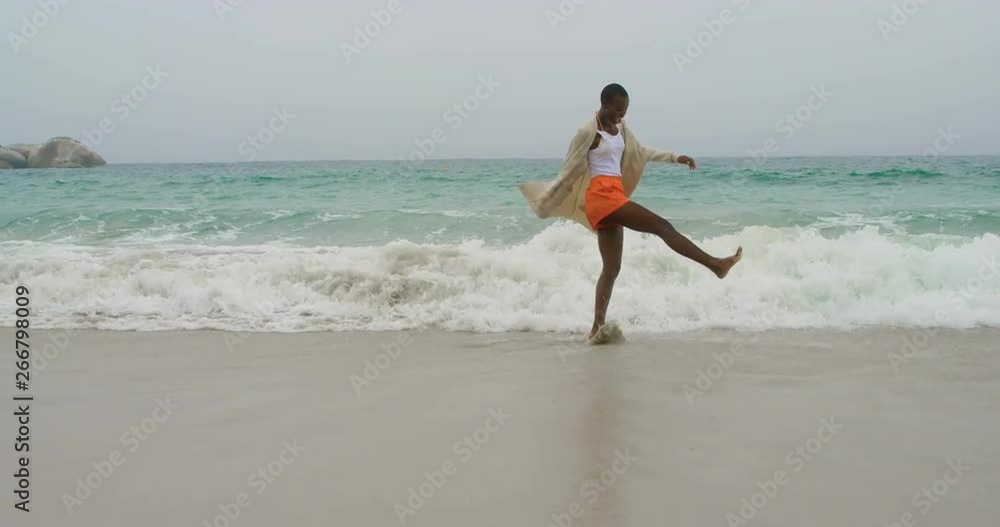 Young African american woman dancing on the beach 4k Young African american woman dancing on the beach 4k