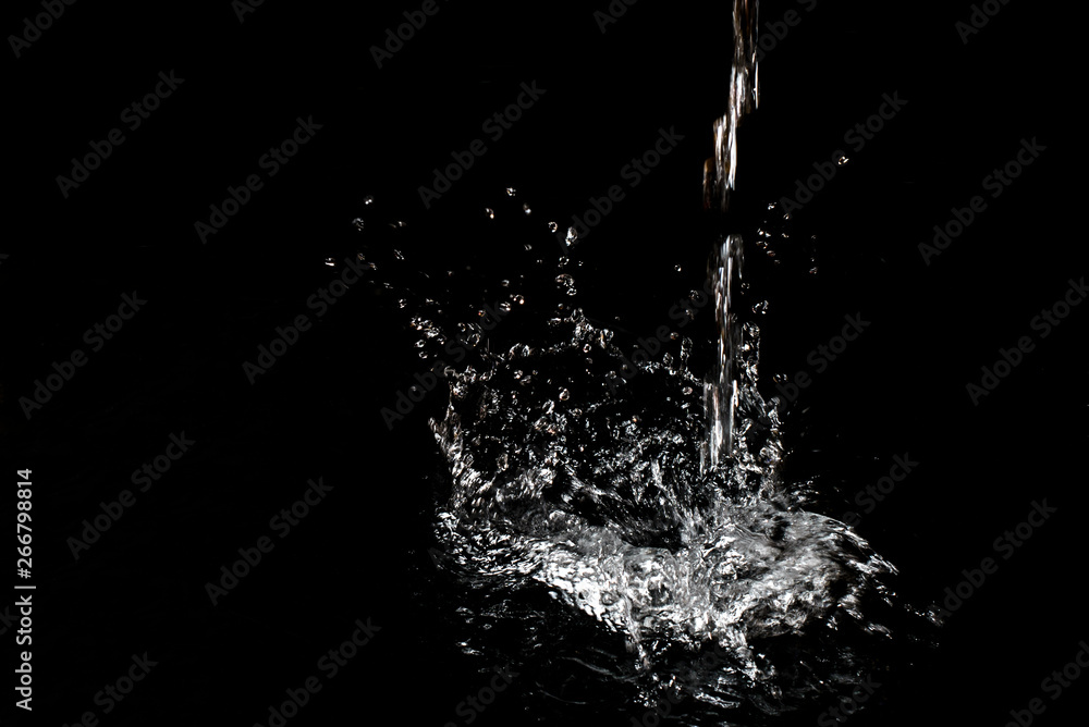 Splash of water. Isolate on black background Splash of water. Isolate on black background