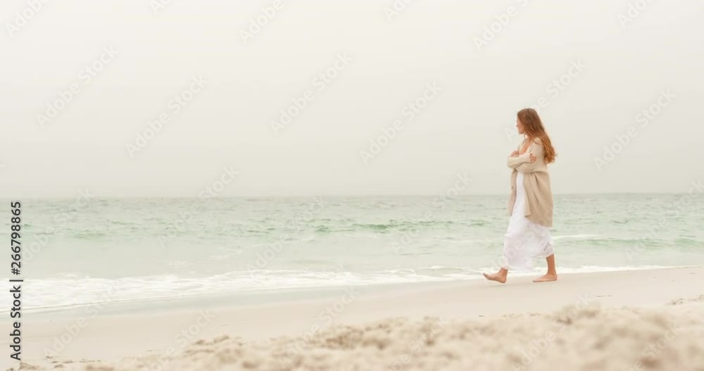 Side view of Caucasian woman walking on the beach 4k Side view of Caucasian woman walking on the beach 4k