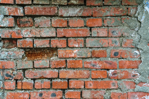 The texture of the brickwork Fragment of the wall of red brick