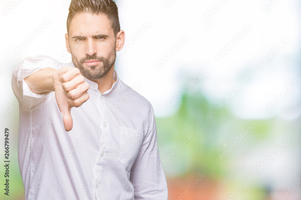 Young business man over isolated background looking unhappy and angry showing rejection and negative with thumbs down gesture. Bad expression. Young business man over isolated background looking unhappy and angry showing rejection and negative with thumbs down gesture. Bad expression.