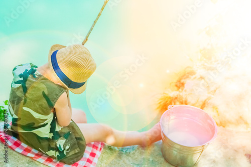 Fotografía happy child fishes off the coast in nature