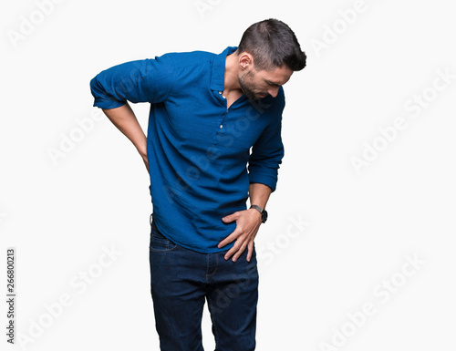 Young handsome man over isolated background Suffering of backache, touching back with hand, muscular pain