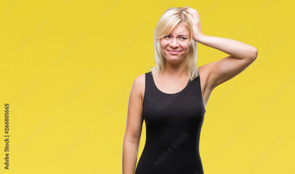 Young beautiful blonde attractive woman wearing elegant dress over isolated background confuse and wonder about question. Uncertain with doubt, thinking with hand on head. Pensive concept. Young beautiful blonde attractive woman wearing elegant dress over isolated background confuse and wonder about question. Uncertain with doubt, thinking with hand on head. Pensive concept.
