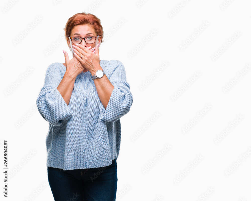 Atrractive senior caucasian redhead woman wearing glasses over isolated background shocked covering mouth with hands for mistake. Secret concept. Atrractive senior caucasian redhead woman wearing glasses over isolated background shocked covering mouth with hands for mistake. Secret concept.