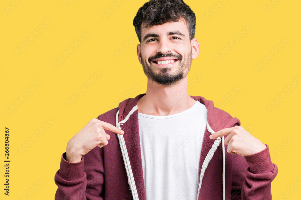 Young handsome man over isolated background looking confident with smile on face, pointing oneself with fingers proud and happy. Young handsome man over isolated background looking confident with smile on face, pointing oneself with fingers proud and happy.